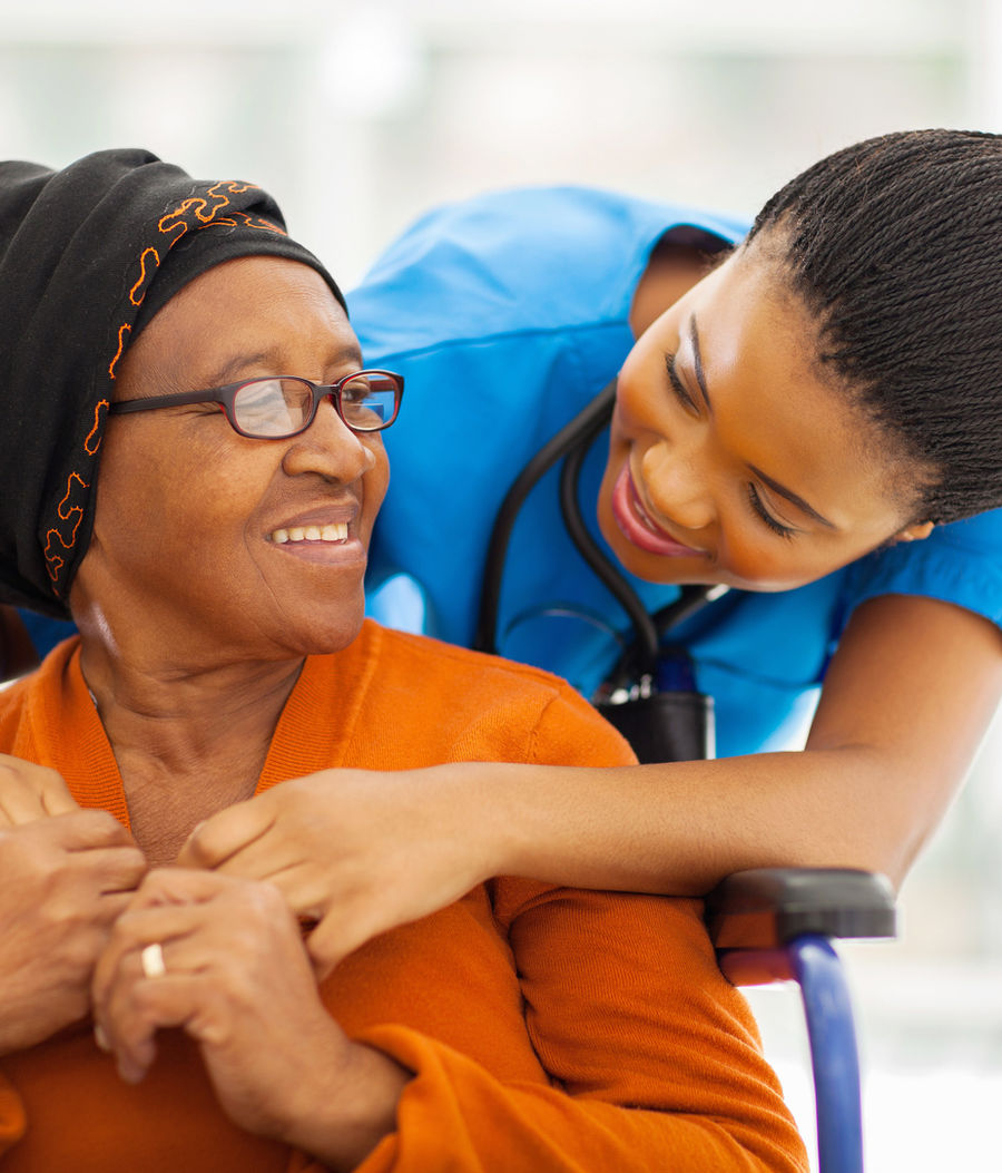Nurse reviewing care documentation with a patient